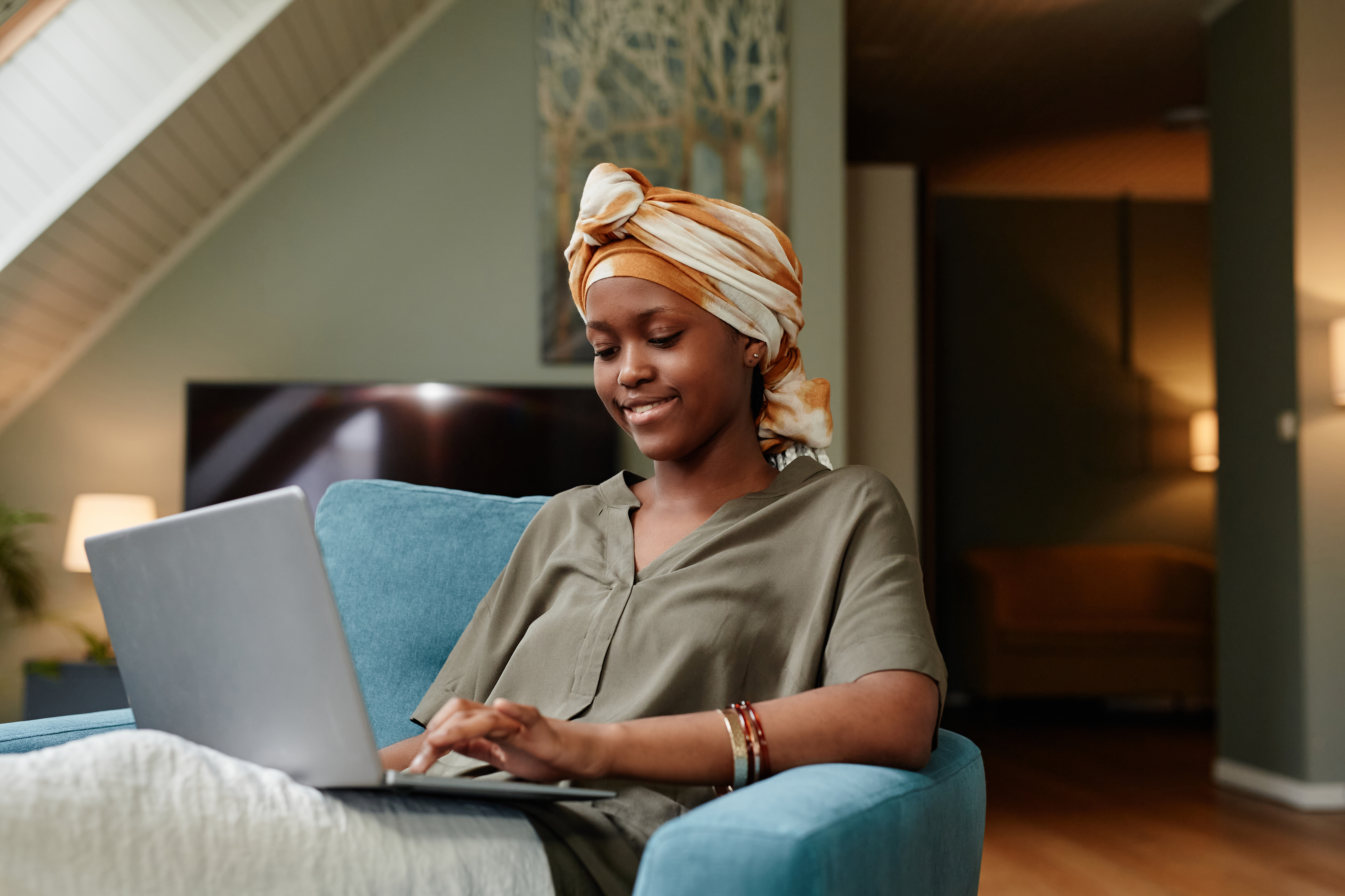 Young African American Woman using laptop