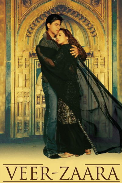 A man and woman embrace in front of a golden doorway. The movie title, Veer-Zaara, appears below them.