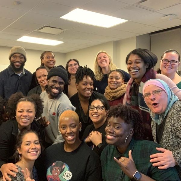 CUNY SPS Youth Studies class smiling and posing for the camera.