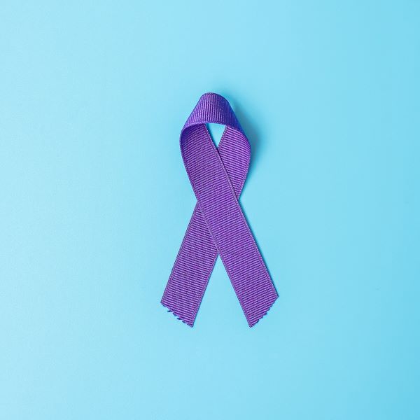 Domestic Violence Awareness Month Poster Featuring a Purple Ribbon