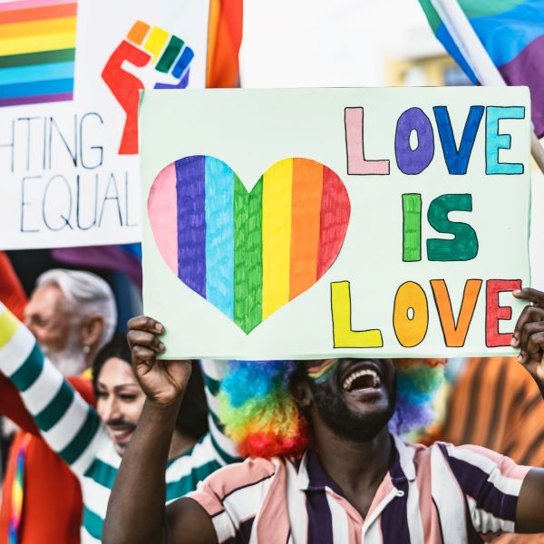 Group of multiracial people celebrating at Gay Pride Parade