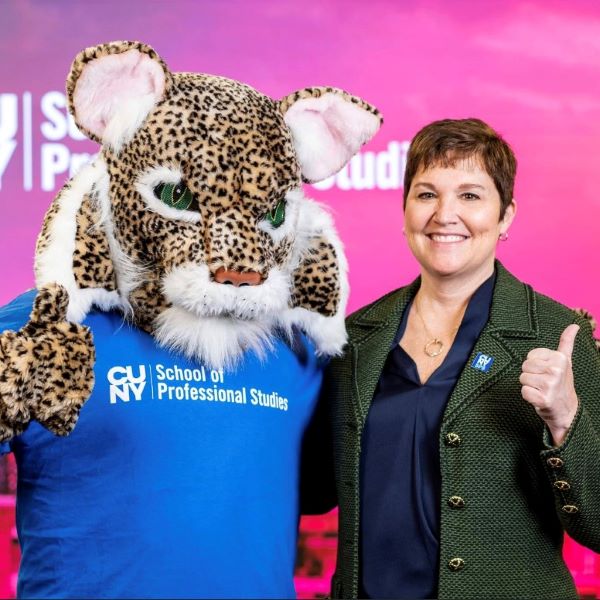 CUNY EVC Hensel Poses with CUNY SPS mascot "Lexington Lynx"