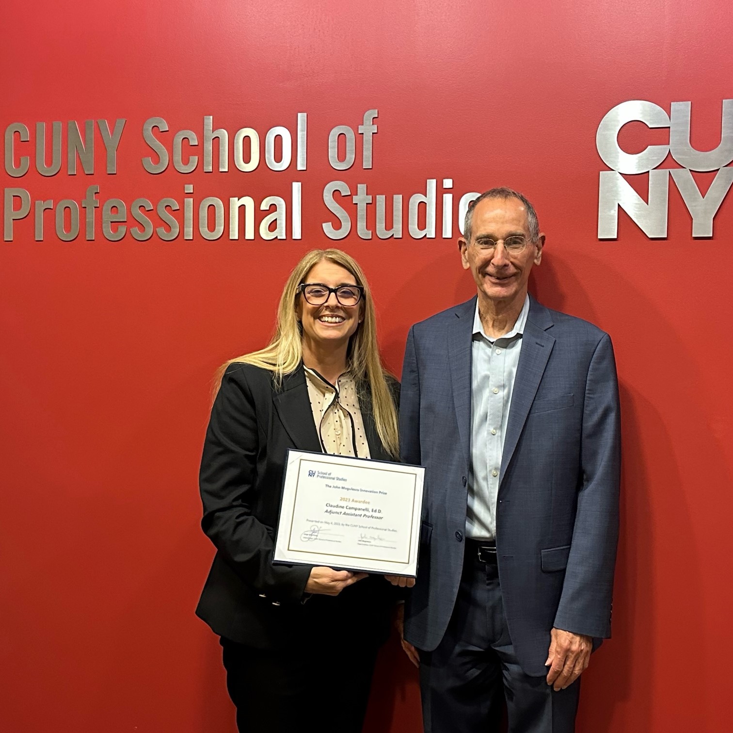 Dr. Claudine Campanelli smiling and standing next to John Mogulescu