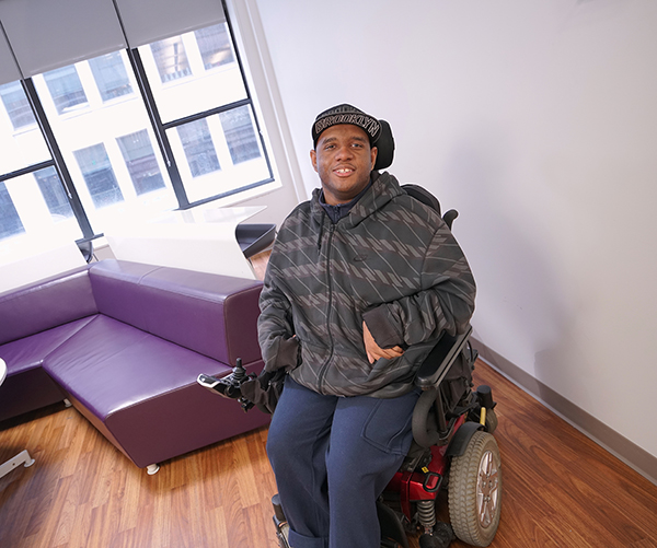 Photo of Leonard Blades sitting in wheelchair at CUNY SPS