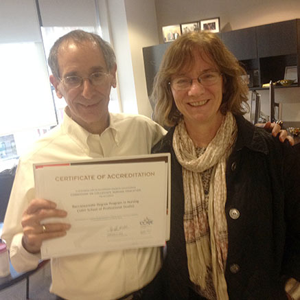 Administrators holding up a certificate