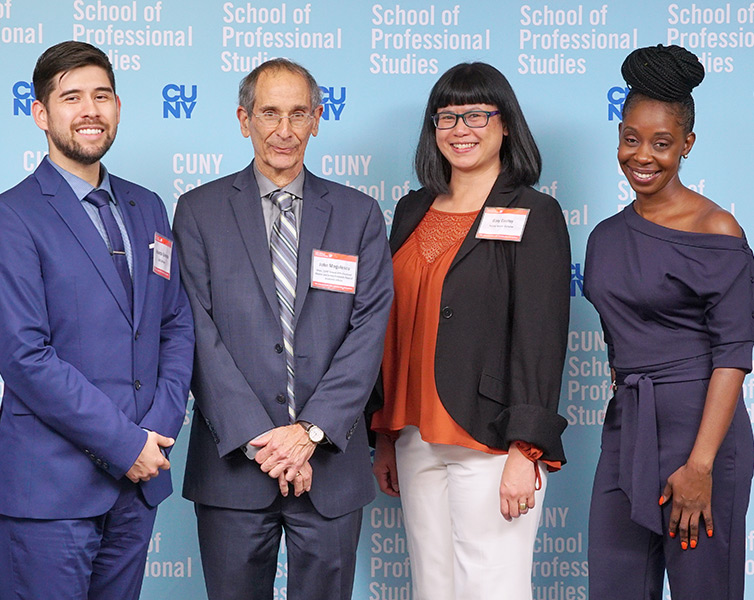 Three student scholarship recipients are joined by Dean John Mogulescu.