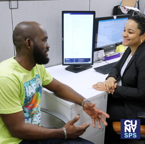 CUNY SPS student speaking with staff member at CUNY SPS