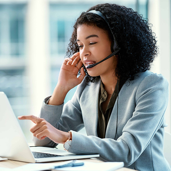 Woman talking on video call on laptop