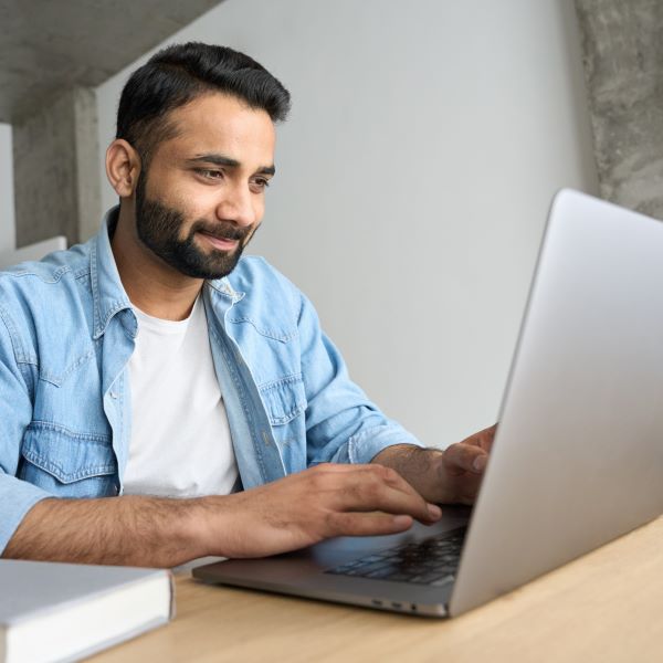 young-happy-hispanic-businessman-working-from-home