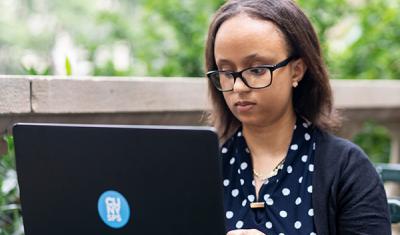 CUNY SPS online adult student working on a project for class