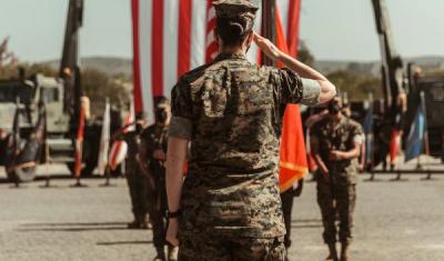 U.S. Marine Corps Lt. Col. Carrie E. Stocker renders a salute during the redesignation of 1st Transportation Support Battalion and deactivation of Landing Support Company and Support Company, 1st Transportation Support Battalion, on Camp Pendleton, California, Apr. 2, 2021. 