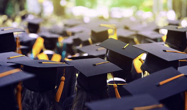 Students at a graduation ceremony in cap and gowns