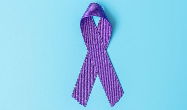 Domestic Violence Awareness Month Poster Featuring a Purple Ribbon