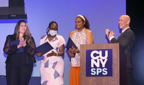 Attendees receiving honors onstage at CUNY SPS 2022 Student Leadership and Recognition Ceremony