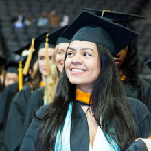 Female student at commencement in regalia