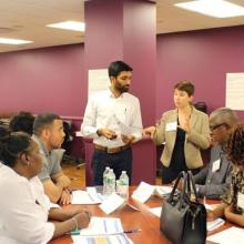 Participants at an in-person DHS FIN program training.