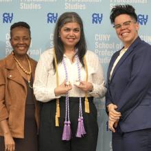 Two female CUNY SPS faculty pose with female graduating nursing student at nursing convocation ceremony