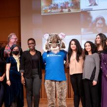 CUNY SPS students, along with School mascot Lexington Lynx, are honored onstage at Graduate Center during 2023 Student Leadership & Service Recognition Ceremony