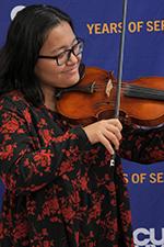 Violinist Reina Hondo performs at the CUNY SPS 2nd Annual Years of Service Awards