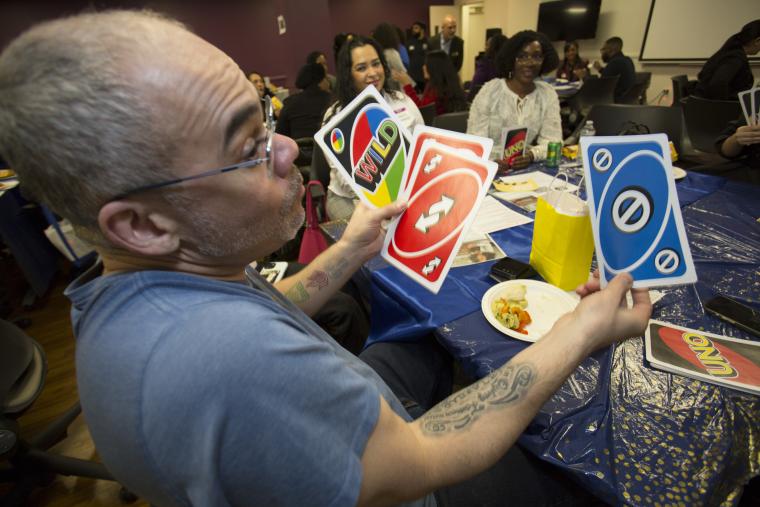 Student playing UNO at club event